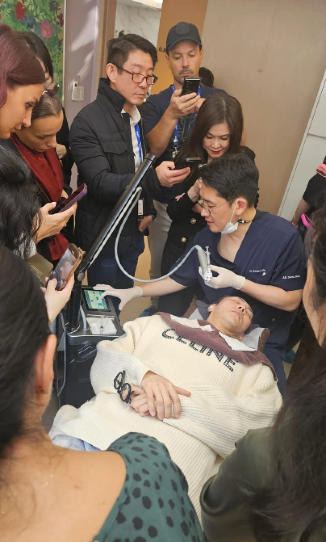 Live treatment demonstration with practitioners filming